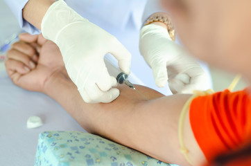 Collection blood in lab scientist with patient, Health check