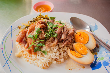 Stewed pork leg on rice, Thai street food.
