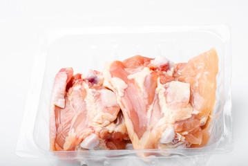 Chicken thighs in plastic pack from supermarket, ready to cook.