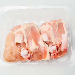 Chicken thighs in plastic pack from supermarket, ready to cook.