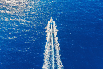 Speed boat in motion. Summer leisure time activity. Aerial top view