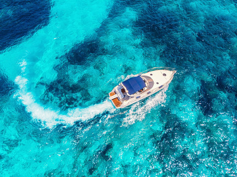 Luxury speed motor boat. Clear blue turquoise water. Aerial view