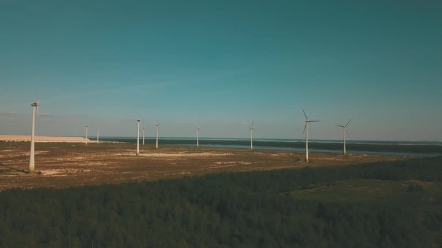 Windmills in summer filde in Estonia, drone footage
