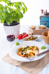 colorful farfalle with green asparagus olives and parma ham