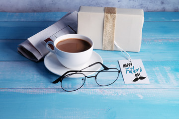 Happy Fathers Day, a cup of coffee with gift box and eyeglasses