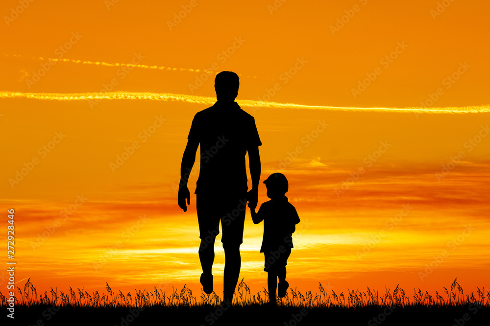 Wall mural father and son walk at sunset