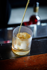 Making drink at bar, free pour 