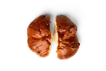 Bun with raisins isolated on white background.