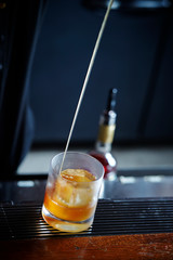 Making drink at bar, free pour 