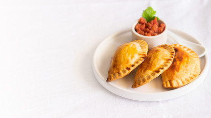 .Fresh baked Empanadillas, small filling  pies. Popular snack Latin American cultures  and Spain. .