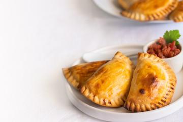 .Fresh baked Empanadillas, small filling  pies. Popular snack Latin American cultures  and Spain. .