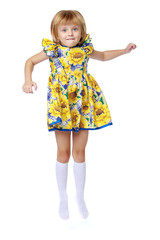 Little girl is jumping.