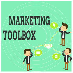 Conceptual hand writing showing Marketing Toolbox. Business photo text Means in promoting a product or services Automation Businessmen Coworker Conference Call Discussion Mobile Phone.