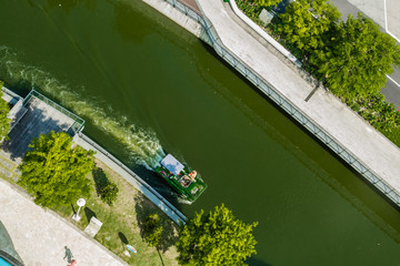 small river clean boat working in the canal