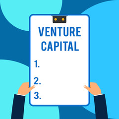 Conceptual hand writing showing Venture Capital. Business photo text financing provided by firms to small early stage ones Male hands holding electronic device geometrical background.