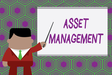 Conceptual hand writing showing Asset Management. Business photo showcasing systematic process of operating and disposing of assets Businessman standing in projector pointing project idea.