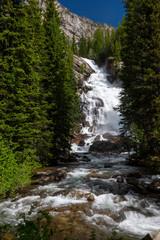 Fototapeta na wymiar Streaming Waterfall with white water and rocks in Montana.