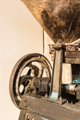 rusty agriculture machine closeup on white background