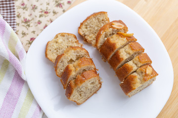 Sliced banana cake on white dish