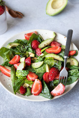 salad with avocado, strawberries and spinach