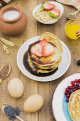 Breakfast with pancakes and strawberries
