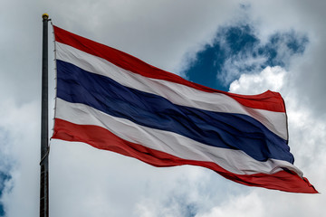 Image of waving Thai flag of Thailand with blue sky background