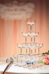 A lot of champagne glasses in a row