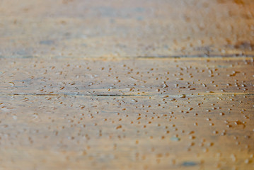 water drops on wooden surface. droplets of raindrop. background