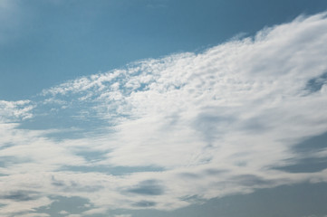 Naklejka na ściany i meble fluffy clouds on a sunny day