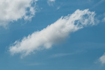 Obraz premium fluffy clouds on a sunny day