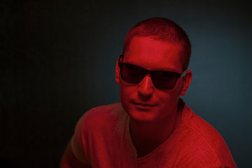 Obraz premium Artistic portrait of a man in two tone lighting