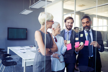 Collaboration and analysis by business people working in office