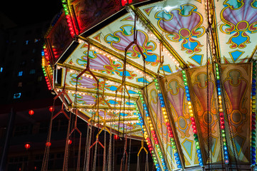 Obraz premium Beautiful bright carousel in park