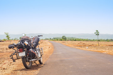 Fototapeta na wymiar Packed motorcycle on the road