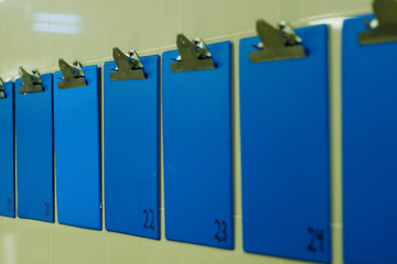 blue color information clip board on wall