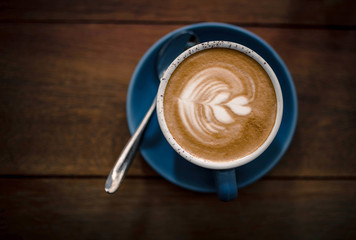 A cup of coffee on the wooden table