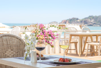 Lunch on a restaurant next to a beach in a tropical location
