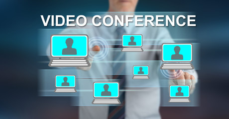 Fototapeta premium Man touching a video conference concept