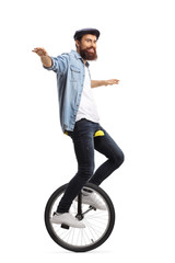 Bearded guy on a unicycle balancing with his hands © Ljupco Smokovski