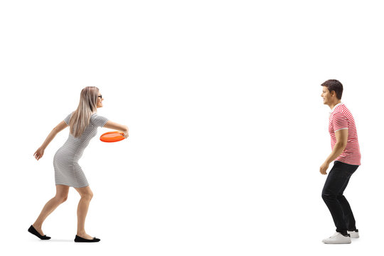 Young man and woman playing with a frisbee