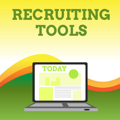 Text sign showing Recruiting Tools. Business photo showcasing getting new talents to your company through internet or ads Open Modern Laptop Switched On with Website Homepage on Screen Web Search