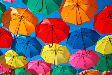 Fototapeta na wymiar Colorful umbrellas in the sky as background. Street decoration. 