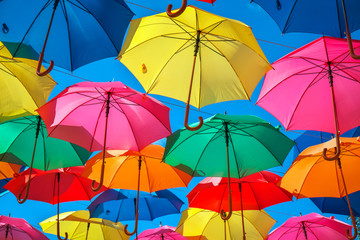 Fototapeta na wymiar Colorful umbrellas in the sky as background. Street decoration. 