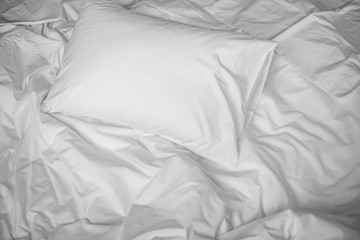 White messy bed top view