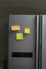blank note pad on the refrigerator
