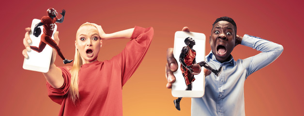 Portrait of people showing mobile phones isolated over orange background. Male and female models using smartphone for talks, chating, betting or online bill payments. Creative collage made of 3 people