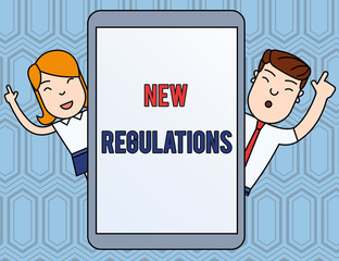 Text sign showing New Regulations. Business photo text Regulation controlling the activity usually used by rules. Male and Female Index Fingers Up Touch Screen Tablet Smartphone Device