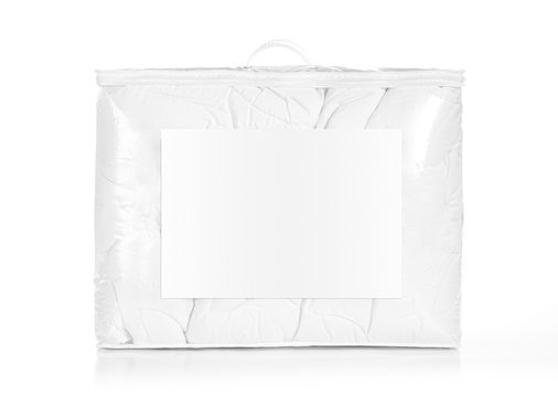 White duvet in the bag isolated. Duvet packed in to the PVC bag.