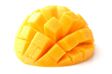 Mango slice cut to cubes close-up isolated on white background