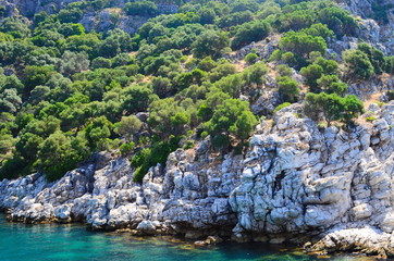 Fototapeta na wymiar amazing clear waters of the Aegean Sea and the rocks